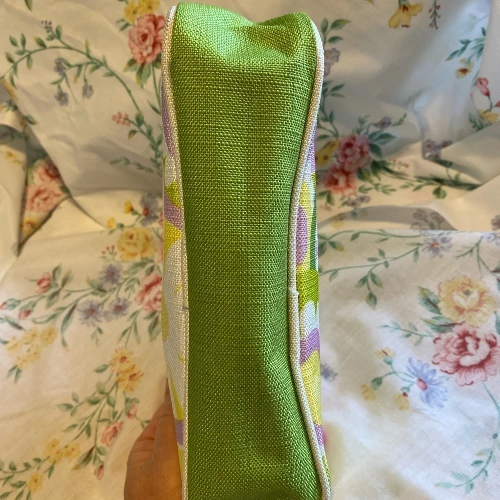 Clinique NWOT cosmetic bag. Green, yellow, purple and white. White inside